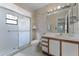 Bathroom with shower stall, updated vanity, and tile flooring at 5439 E Sacramento Ct, Orlando, FL 32821