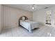 Bedroom featuring tile flooring, wallpaper, and ceiling fan at 5439 E Sacramento Ct, Orlando, FL 32821