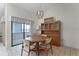 Bright dining area with a chandelier, wooden table, and a large sliding glass door providing natural light at 5439 E Sacramento Ct, Orlando, FL 32821