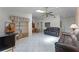 Bright living room with tile floor and open view to dining area offering an airy and connected living space at 5439 E Sacramento Ct, Orlando, FL 32821