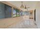 Sunroom with large windows offering bright natural light and tile flooring at 5439 E Sacramento Ct, Orlando, FL 32821