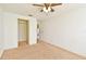 Bedroom featuring carpet, a ceiling fan, and a closet at 5588 Garden Grove Cir, Winter Park, FL 32792