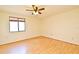 Bedroom with hardwood floors, a window, and a ceiling fan at 5588 Garden Grove Cir, Winter Park, FL 32792