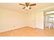 Bedroom featuring wood-look floors, ceiling fan, and an attached bathroom with a shower at 5588 Garden Grove Cir, Winter Park, FL 32792