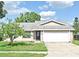 Charming single-story home with a well-maintained lawn and inviting curb appeal at 5588 Garden Grove Cir, Winter Park, FL 32792