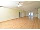 Spacious living room featuring hardwood floors and ample natural light at 5588 Garden Grove Cir, Winter Park, FL 32792