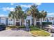 Inviting condo building with palm trees, and well-maintained landscaping at 711 Sugar Bay Way # 109, Lake Mary, FL 32746