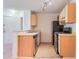 Charming kitchen featuring modern appliances, ample cabinetry, and a functional layout at 711 Sugar Bay Way # 109, Lake Mary, FL 32746