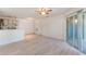 Bright living room with a ceiling fan, tile floors, and a sliding glass door to the patio at 711 Sugar Bay Way # 109, Lake Mary, FL 32746