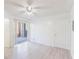 Spacious bedroom featuring a sliding door to a private patio, and laminate flooring at 711 Sugar Bay Way # 109, Lake Mary, FL 32746
