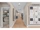 Inviting hallway featuring stylish decor and wood flooring, leading to various rooms in the home at 7408 Olivewood Ave, Orlando, FL 32829
