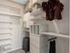 Spacious walk-in closet with custom shelving, drawers, and ample storage space at 7408 Olivewood Ave, Orlando, FL 32829
