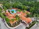 Aerial view featuring the community's pool, clubhouse, and meticulously kept landscaping at 8020 Tuscany Way # 6301, Davenport, FL 33896