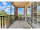 Relaxing balcony with outdoor seating and views of the lush landscape at 8020 Tuscany Way # 6301, Davenport, FL 33896
