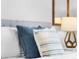 Bedroom with neutral color palette, reading lamps, and decorative pillows at 8020 Tuscany Way # 6301, Davenport, FL 33896