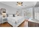 Cozy bedroom features a large window, ceiling fan, and comfortable furnishings at 8020 Tuscany Way # 6301, Davenport, FL 33896