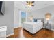 Cozy bedroom features a large window, ceiling fan, and comfortable furnishings at 8020 Tuscany Way # 6301, Davenport, FL 33896