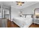 Well-lit bedroom with a ceiling fan, comfortable bed, and neutral decor at 8020 Tuscany Way # 6301, Davenport, FL 33896