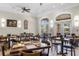 Bright dining area featuring neutral walls, tile flooring, and modern ceiling fan at 8020 Tuscany Way # 6301, Davenport, FL 33896