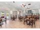Spacious dining area offers neutral walls and a view of the outdoors with convenient access to bar at 8020 Tuscany Way # 6301, Davenport, FL 33896