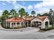 Well-manicured landscaping surrounds entrance with decorative pavers at 8020 Tuscany Way # 6301, Davenport, FL 33896