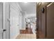 Bright foyer features tile flooring, white trim, wood floors, and a glimpse of the open floor plan at 8020 Tuscany Way # 6301, Davenport, FL 33896