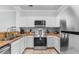 Well-equipped kitchen with stainless steel appliances, stylish cabinets, and sleek countertops for easy meal preparation at 8020 Tuscany Way # 6301, Davenport, FL 33896