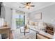 Cozy living room with natural light and a sliding glass door leading to the balcony at 8020 Tuscany Way # 6301, Davenport, FL 33896