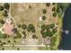 Expansive aerial view of property featuring a home, lush landscaping, and a private lake at 9400 Laws Road, Clermont, FL 34714