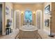 Luxurious bathroom featuring a centerpiece tub at 9400 Laws Road, Clermont, FL 34714