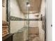 Modern bathroom features glass-enclosed shower and tiled bench at 9400 Laws Road, Clermont, FL 34714