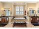 Luxurious bathroom featuring dual sinks, a soaking tub, and elegant fixtures at 9400 Laws Road, Clermont, FL 34714