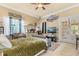 Cozy bedroom with a comfortable bed and access to a private patio at 9400 Laws Road, Clermont, FL 34714