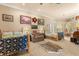 Spacious bedroom featuring two twin beds, neutral tones, and ample natural light at 9400 Laws Road, Clermont, FL 34714