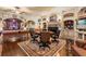 Spacious game room featuring a pool table, card table, fireplace, and built-in shelving at 9400 Laws Road, Clermont, FL 34714