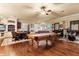 Large game room with a pool table, drum set, piano, and seating area, great for entertainment at 9400 Laws Road, Clermont, FL 34714
