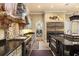 Well-appointed kitchen with stone accents, professional-grade appliances, and ample counter space for cooking and prep at 9400 Laws Road, Clermont, FL 34714