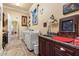 Functional laundry room with modern washer and dryer, built-in sink, and ample counter space at 9400 Laws Road, Clermont, FL 34714