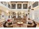Beautiful living room with elegant decor, archways, and wood floors at 9400 Laws Road, Clermont, FL 34714