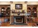 Cozy living room features custom built-ins and fireplace at 9400 Laws Road, Clermont, FL 34714