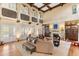 Stately living room with high ceilings, fireplace, and French doors at 9400 Laws Road, Clermont, FL 34714