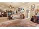 Serene main bedroom with a decorative ceiling fan, and adjoining sitting area and bath at 9400 Laws Road, Clermont, FL 34714