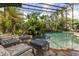 Tranquil pool with lush landscaping and comfortable patio furniture at 9400 Laws Road, Clermont, FL 34714