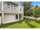 Well-maintained backyard with lush green grass and a private white fence at 995 Grand Wildmere, Longwood, FL 32750