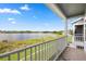 Scenic balcony view overlooking the lake and lush greenery at 995 Grand Wildmere, Longwood, FL 32750