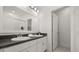 Stylish bathroom with double sink vanity, sleek countertops, and bright modern lighting at 995 Grand Wildmere, Longwood, FL 32750