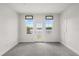 Bright bedroom with a waterfront view, access to a balcony and neutral carpeting at 995 Grand Wildmere, Longwood, FL 32750