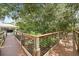 Wooden boardwalk with a fenced in area and lush greenery at 995 Grand Wildmere, Longwood, FL 32750