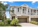 Charming two-story townhouse featuring a private balcony and a convenient attached two-car garage at 995 Grand Wildmere, Longwood, FL 32750