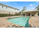 Community pool with a covered cabana at 995 Grand Wildmere, Longwood, FL 32750
